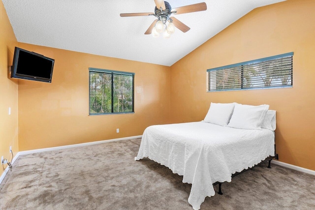 bedroom with carpet, ceiling fan, and vaulted ceiling