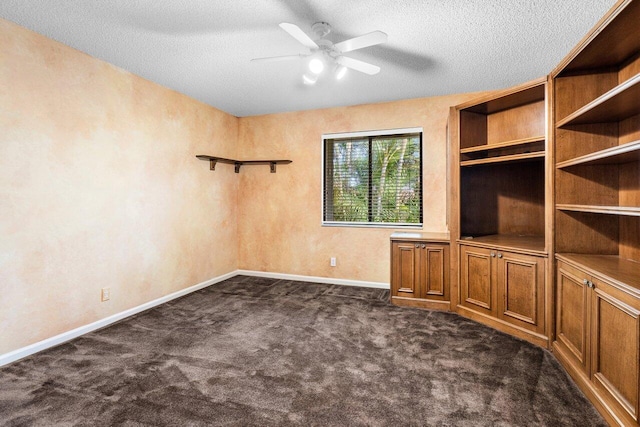 interior space featuring a textured ceiling and ceiling fan