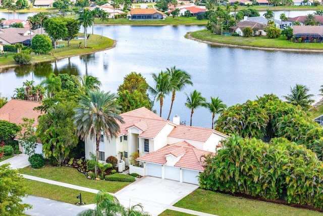 birds eye view of property featuring a water view