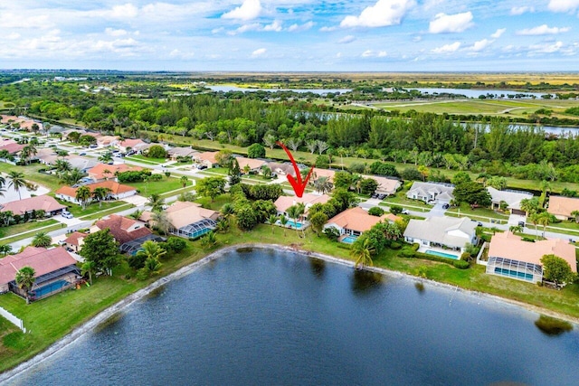 birds eye view of property with a water view