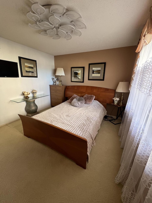 carpeted bedroom with a textured ceiling