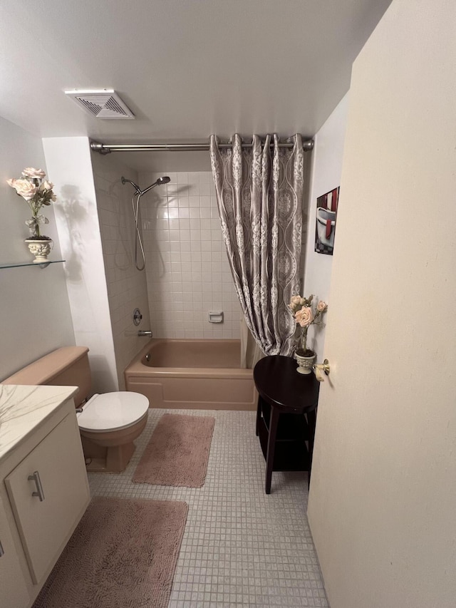 bathroom with shower / bath combo with shower curtain, visible vents, and toilet
