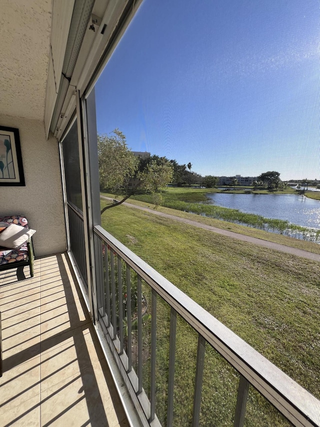 balcony featuring a water view