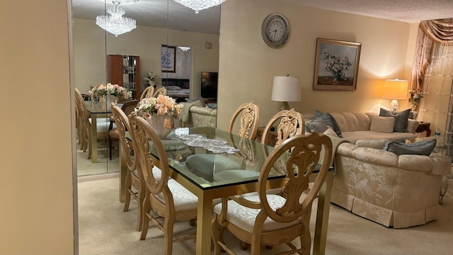 carpeted dining room with a textured ceiling and a notable chandelier