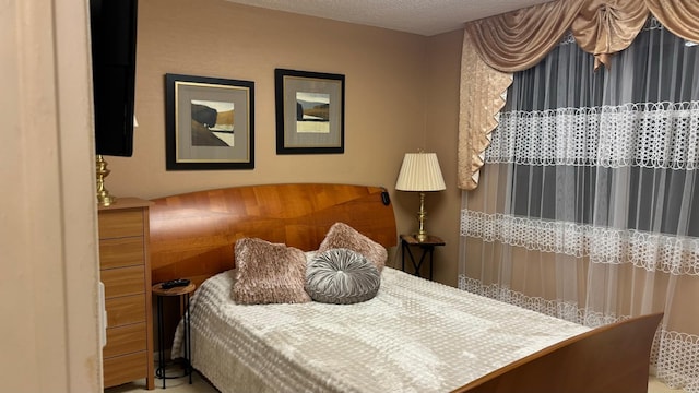 bedroom featuring a textured ceiling