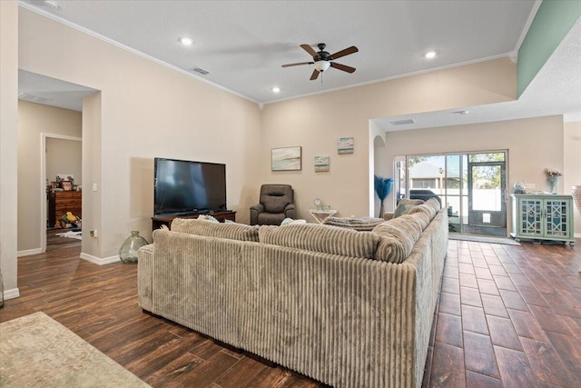 living room with ceiling fan and ornamental molding