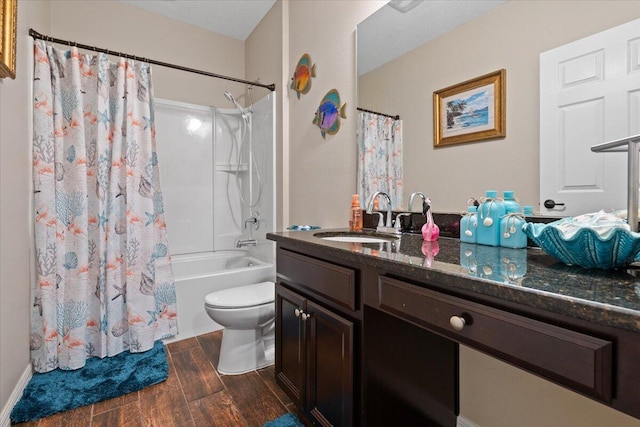 full bathroom with shower / bath combination with curtain, vanity, and toilet