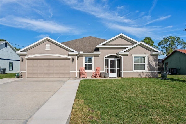 view of front of house with a front yard, a garage, and central AC unit