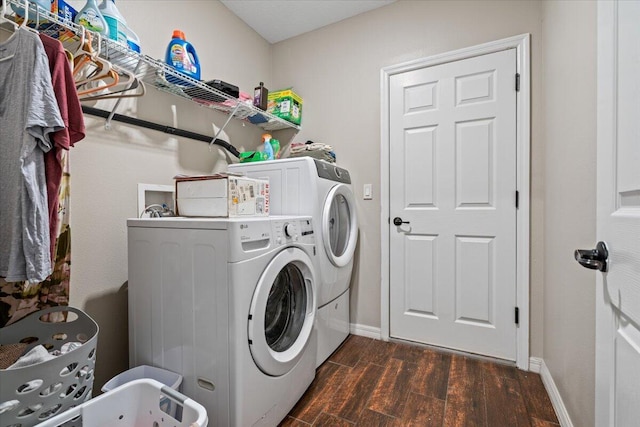 clothes washing area featuring independent washer and dryer