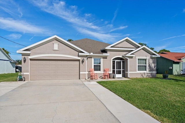 view of front of home with a front lawn and a garage