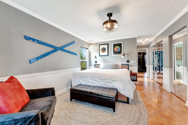 tiled bedroom with a textured ceiling and ornamental molding