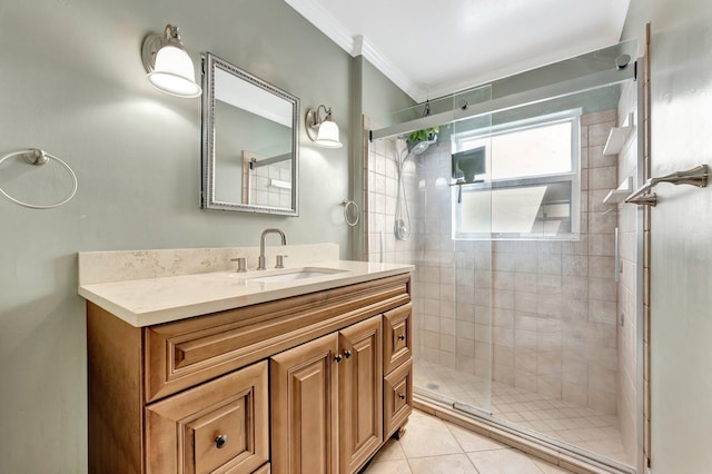 bathroom with tile patterned floors, vanity, an enclosed shower, and ornamental molding