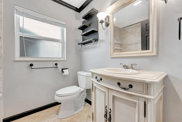 bathroom featuring vanity, toilet, walk in shower, and crown molding