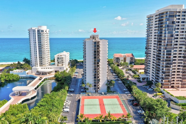 birds eye view of property with a water view