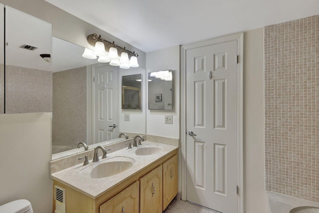 bathroom with vanity and toilet