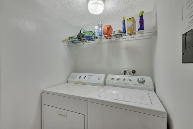 clothes washing area featuring a textured ceiling and independent washer and dryer