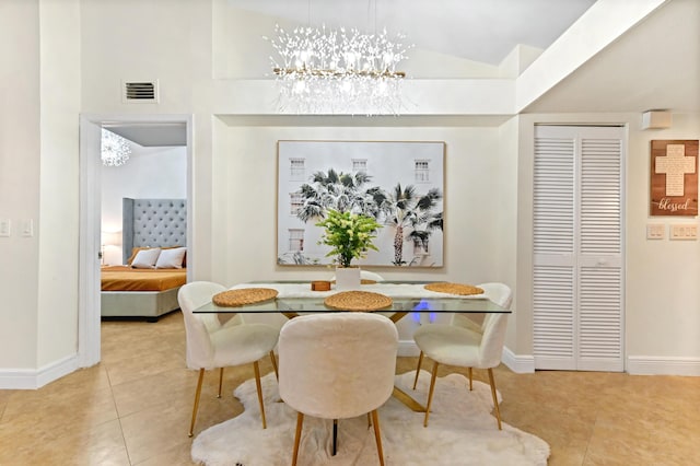 tiled dining room featuring a notable chandelier and vaulted ceiling