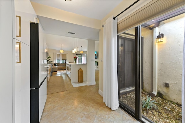 5272 Bolero Cir, Delray Beach, FL 33484 - hallway featuring light tile patterned floors