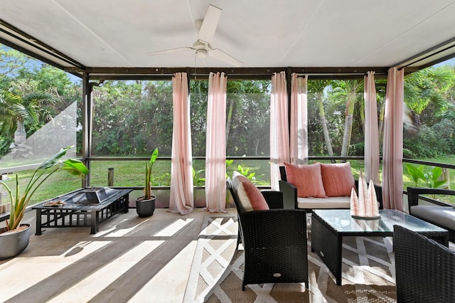 sunroom / solarium featuring ceiling fan