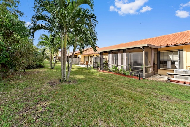 view of yard with a sunroom