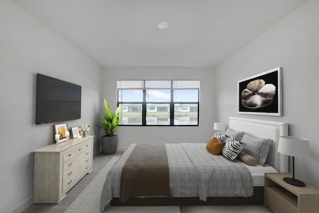 bedroom featuring light colored carpet