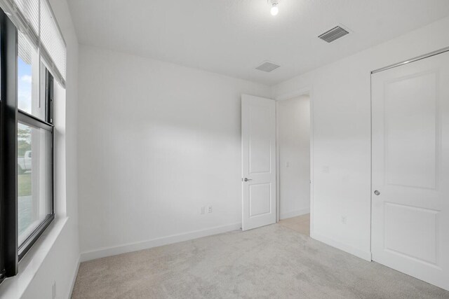 12535 SW Blue Mangrove Pkwy, Port Saint Lucie, FL 34987 - unfurnished bedroom with carpet and baseboards