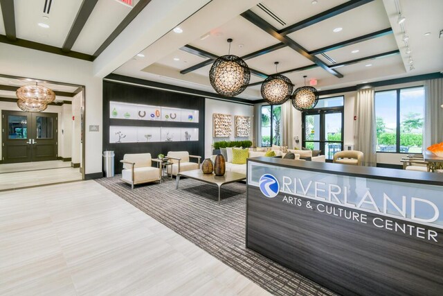 12535 SW Blue Mangrove Pkwy, Port Saint Lucie, FL 34987 - reception area with a chandelier, coffered ceiling, beamed ceiling, and recessed lighting
