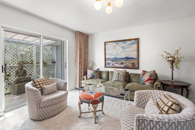 living room with a textured ceiling and an inviting chandelier