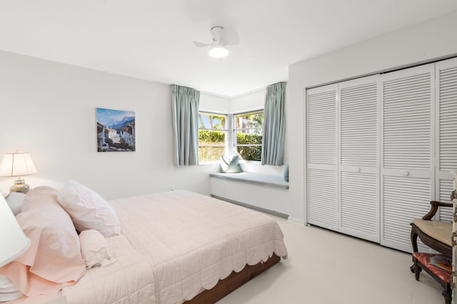 bedroom featuring ceiling fan and a closet