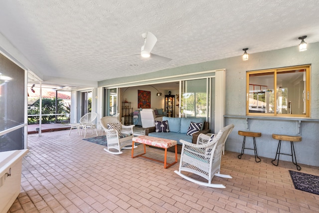 view of patio / terrace featuring ceiling fan and an outdoor hangout area