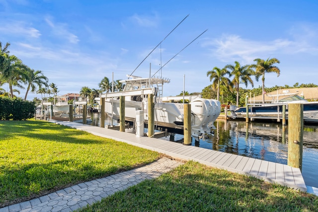 dock area with a water view and a yard