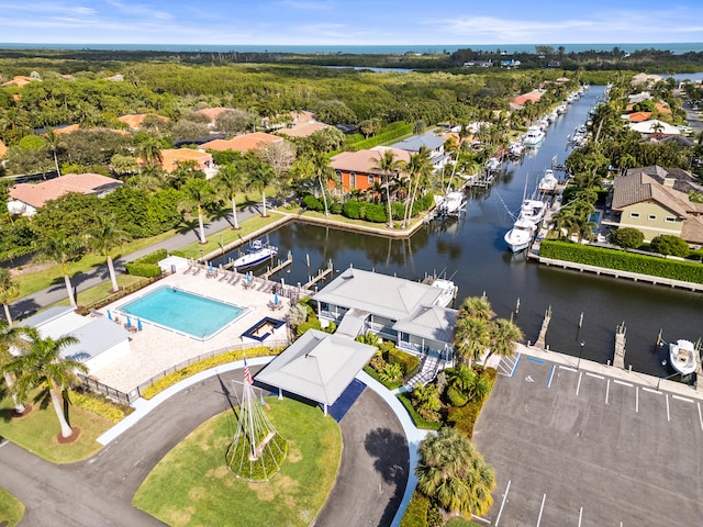 birds eye view of property featuring a water view