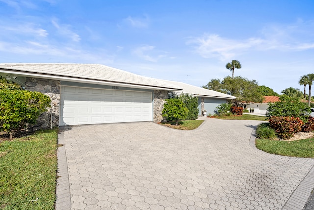 ranch-style home featuring a garage