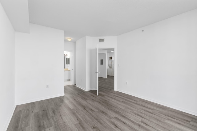 unfurnished living room featuring dark hardwood / wood-style floors