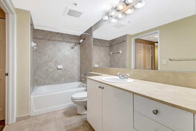 700 E Boynton Beach Blvd Unit 407, Boynton Beach, FL 33435 - full bathroom featuring washtub / shower combination, toilet, tile patterned floors, and vanity