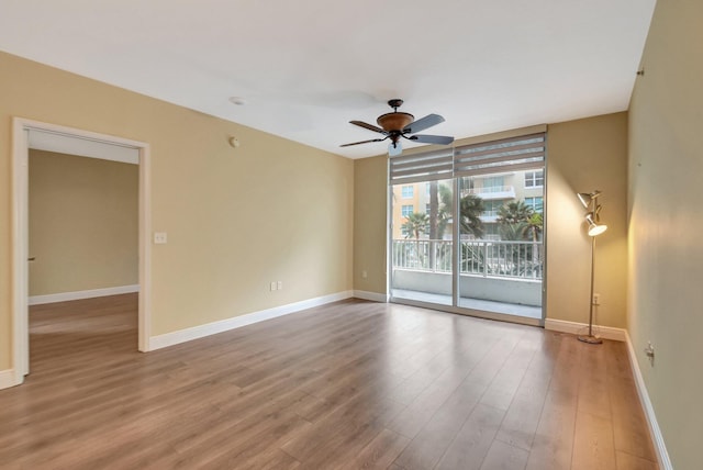 unfurnished room with ceiling fan and light hardwood / wood-style flooring