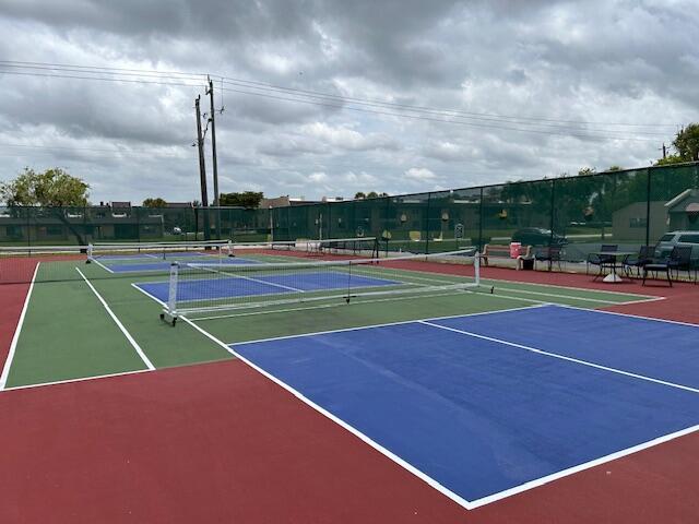 view of tennis court featuring basketball court