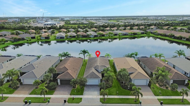 birds eye view of property featuring a water view