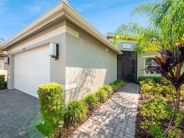 doorway to property featuring a garage