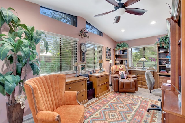 home office with ceiling fan and vaulted ceiling