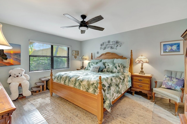 bedroom with ceiling fan and light wood-type flooring