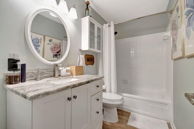 full bathroom featuring shower / bath combination with curtain, vanity, toilet, and hardwood / wood-style floors