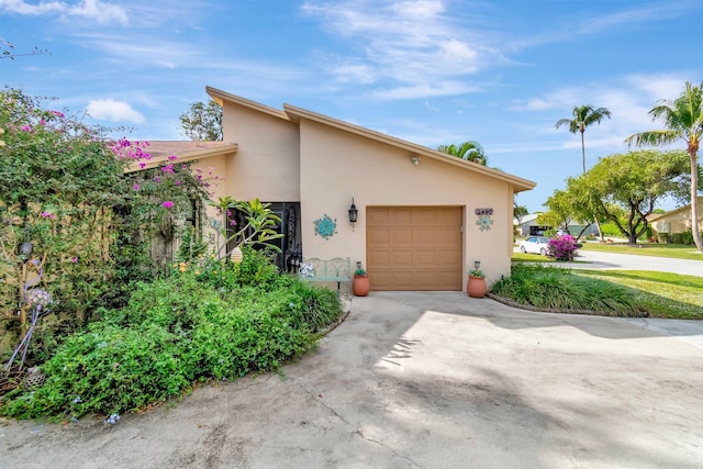 view of side of property featuring a garage