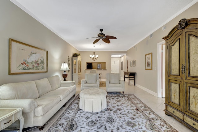 living room featuring ceiling fan with notable chandelier, light tile patterned floors, and crown molding