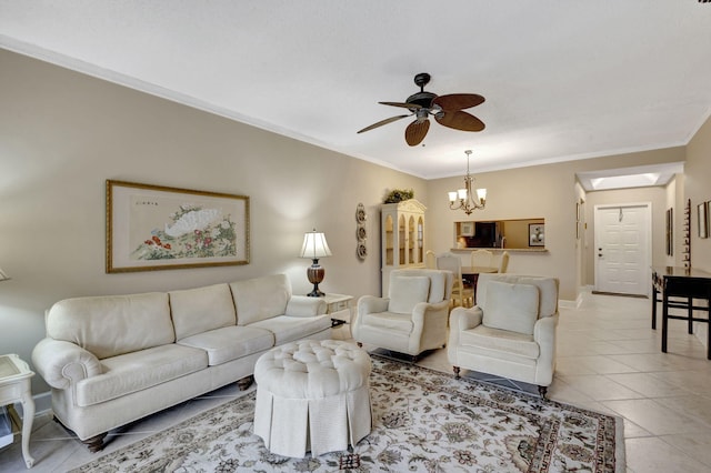 living room with light tile patterned floors, ceiling fan with notable chandelier, and ornamental molding