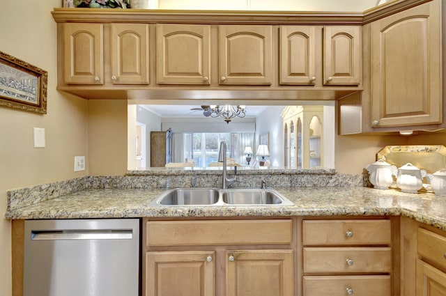 kitchen featuring stainless steel dishwasher, light brown cabinets, light stone countertops, and sink