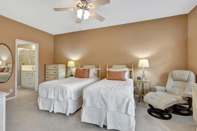 bedroom with connected bathroom, ceiling fan, and light tile patterned floors