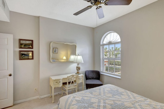 tiled bedroom with ceiling fan