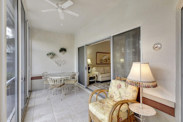 sunroom featuring ceiling fan