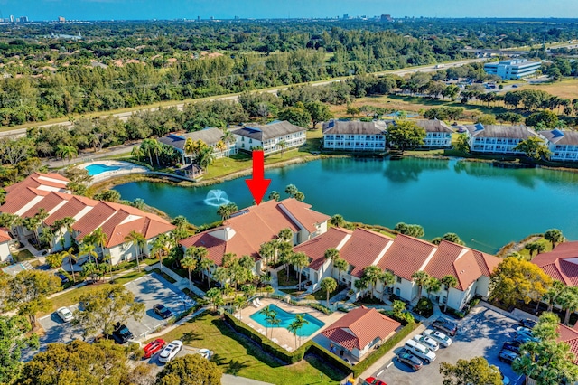 birds eye view of property featuring a water view